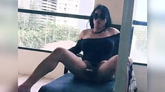 tranny stroking her big cock in her hotel balcony Thumb